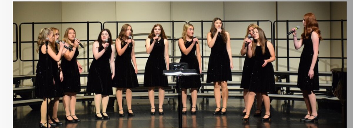 CHS vocal ensemble performing on stage